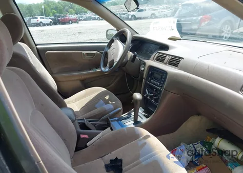 1999 Toyota Camry Le z USA, uszkodzony, nr VIN 4T1BG22K7XU604965